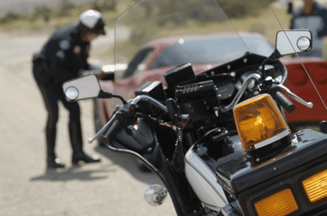 Police officer pulling a car over