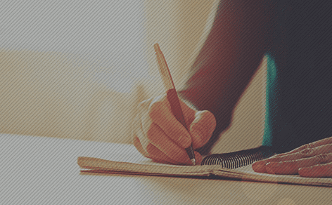 Man writing in a journal