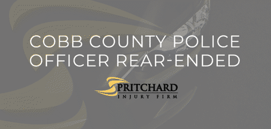 Pritchard Injury Firm logo and the words Cobb County Police officer rear-ended
